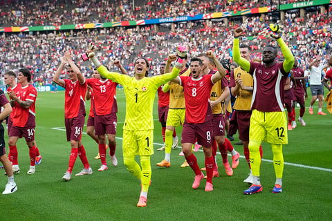 Switzerland players celebrate their win against Italy